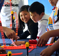Image of girl and boy participating in Festival activity.